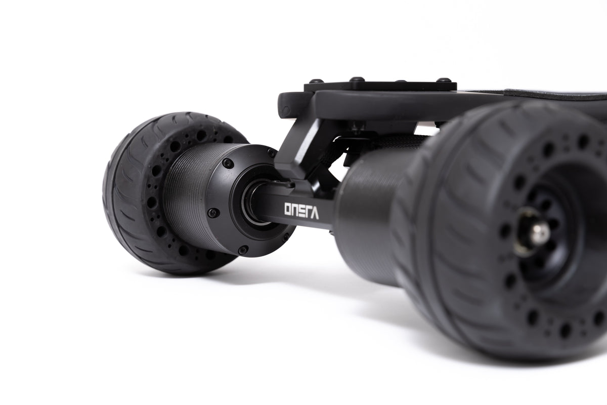 ONSRA direct drive truck with black street wheels, studio side view