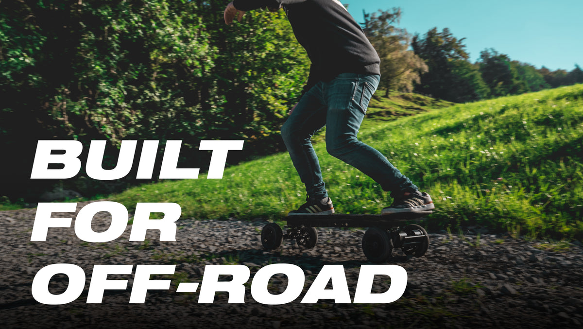 Rider on the ONSRA Challenger Pro All-Terrain on a grassy hill – "Built for off-road"
