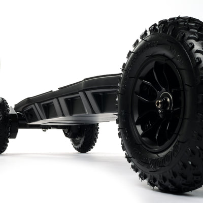 ONSRA BLACK Carve 4 premium electric longboard with a flexible bamboo deck, Gear Drive drivetrain, 14S battery, precision trucks, and all-terrain wheels, shown in a side profile.