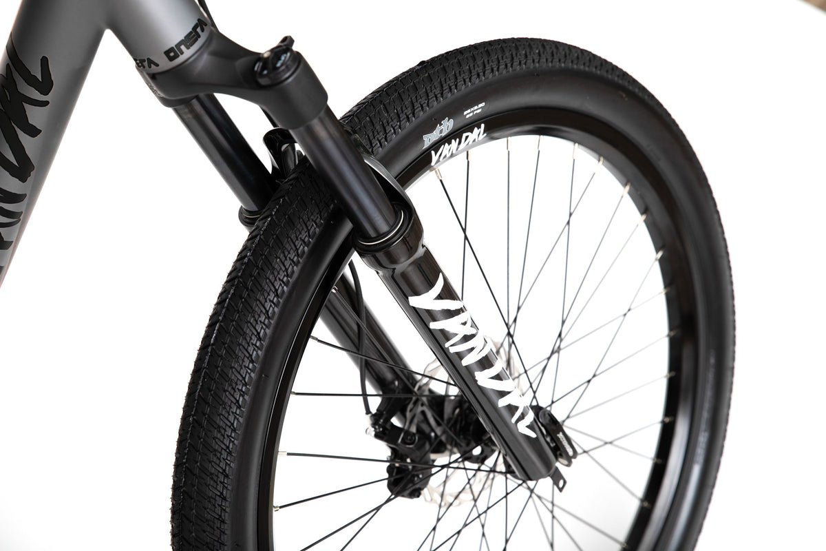 ONSRA VANDAL electric bike front fork and tire close-up